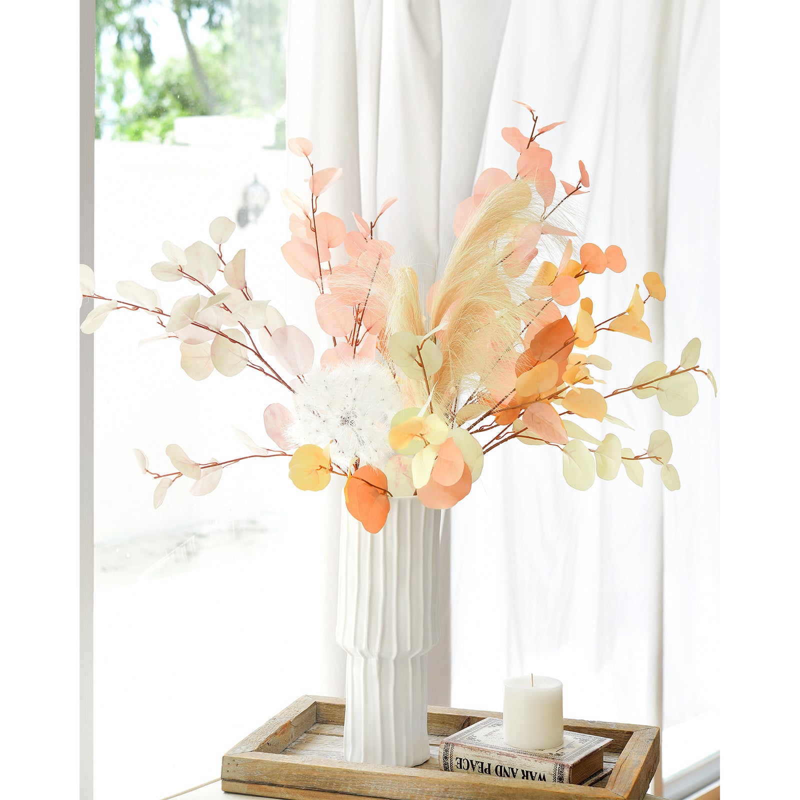 Elegant silk eucalyptus stems in Dusky Ember and Burnt Orange displayed in a bright room, perfect for modern home decor.