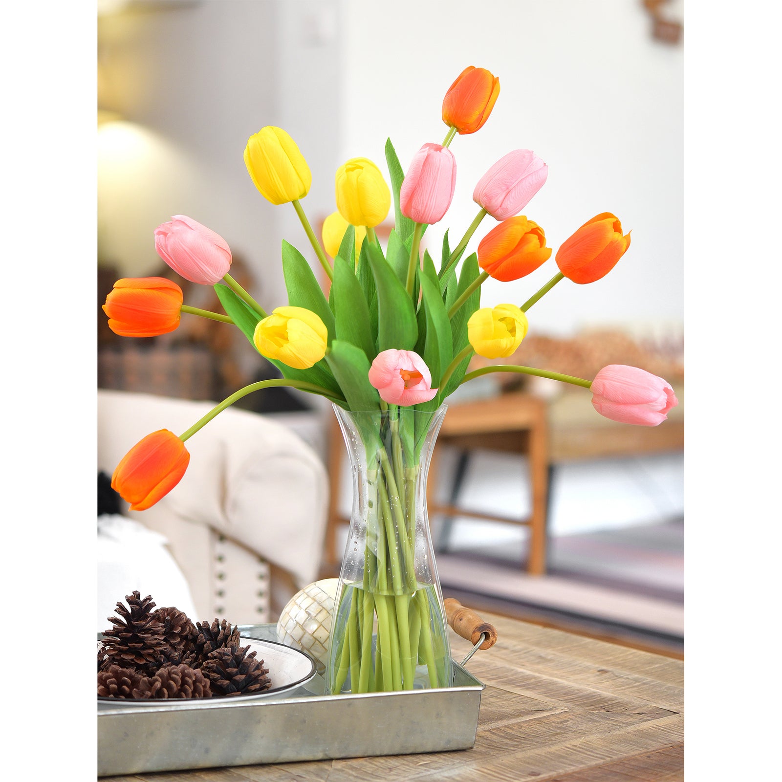 Realistic tulip blooms with vibrant petals and green stems styled on a wooden tray for a natural look.





