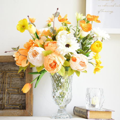 Vibrant orange and white peony silk bouquet in a crystal vase, perfect for brightening home décor or seasonal celebrations