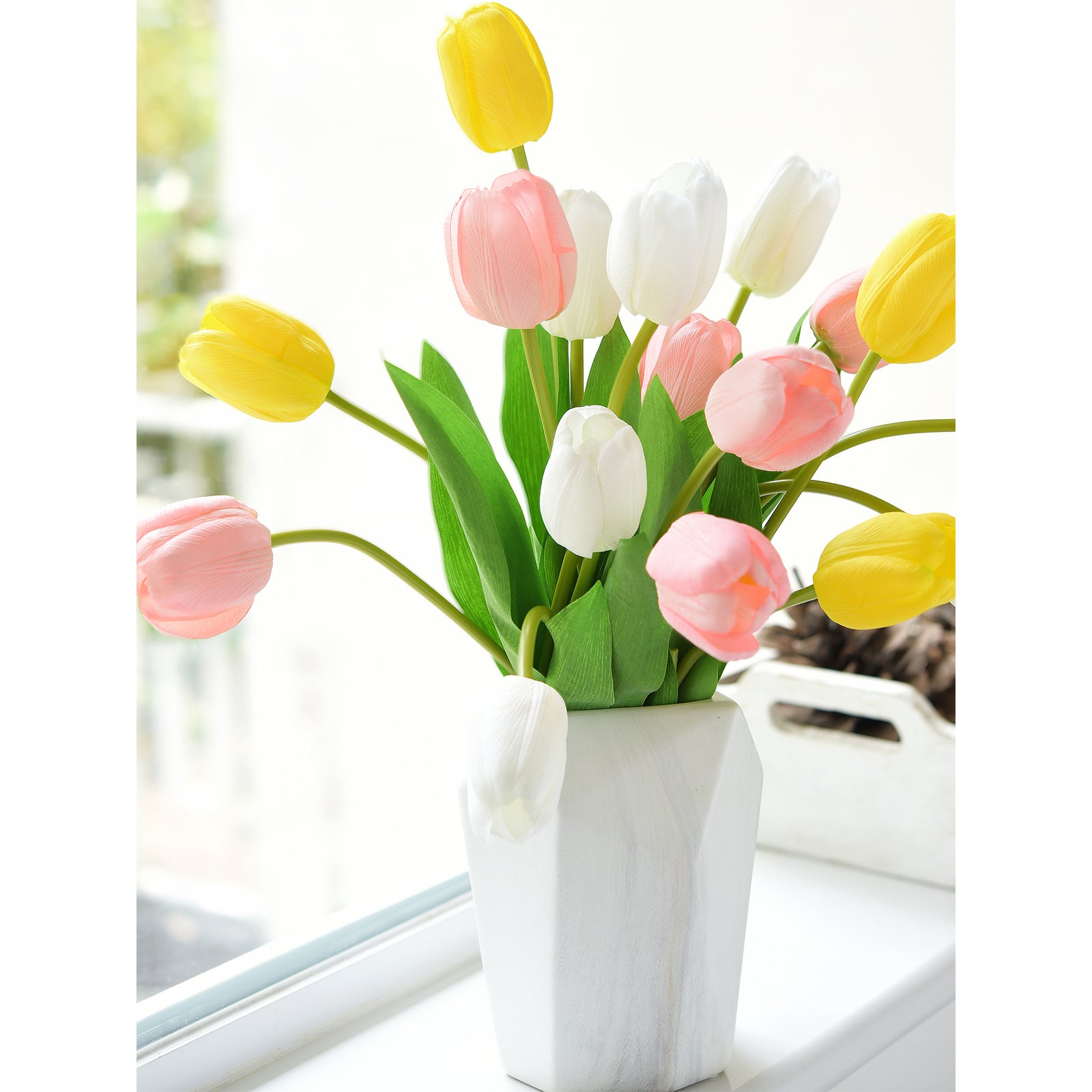 Charming artificial tulip display featuring white, pink, and yellow tulips in a modern white vase.