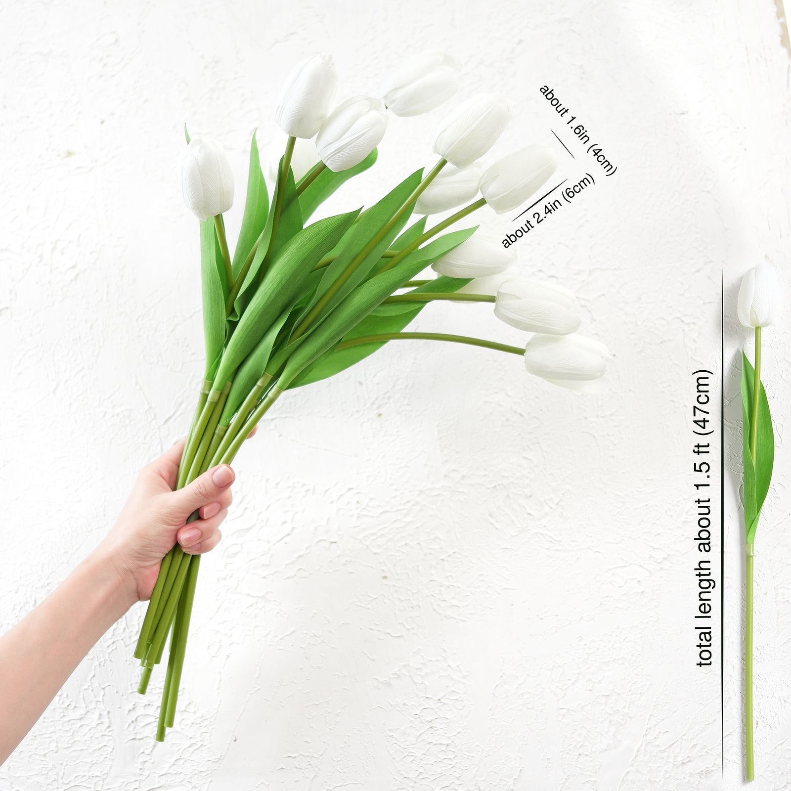 Hand holding a bouquet of long-stemmed artificial white tulips with measurement details for DIY arrangements