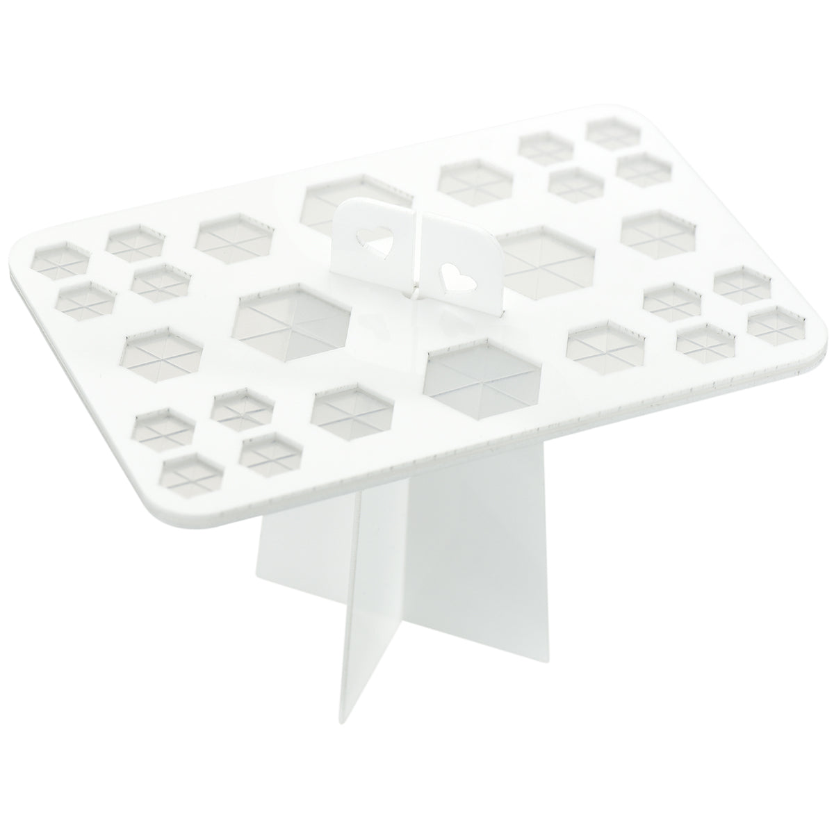 A white acrylic makeup brushes drying rack with 26 silicone holes in hexagon shape. 